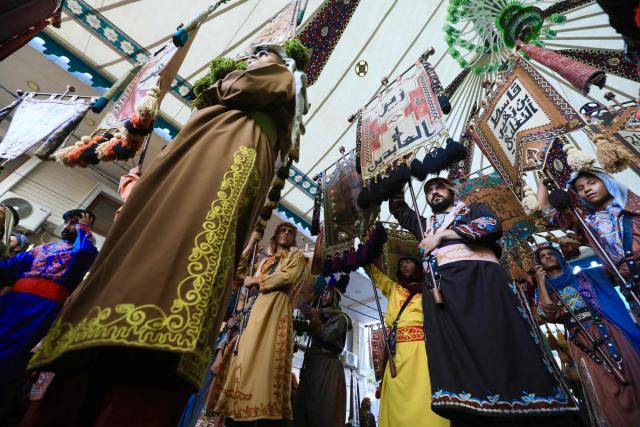Shiite mourners take part in the Al-Haidariyah Public Procession reenacting the arrival of Imam Hussein, his family and companions in the Iraqi holy city of Karbala on the second day of Muharram, during commemorations marking Ashura on June 18, 2026. Ashura is one of the most important commemorations for Shiite Muslims, and falls on the 10th day of Muharram, which is the mourning period for the seventh-century killing of Imam Hussein, the grandson of the Prophet Muhammad. (Photo by Karar Jabbar / AFP)
