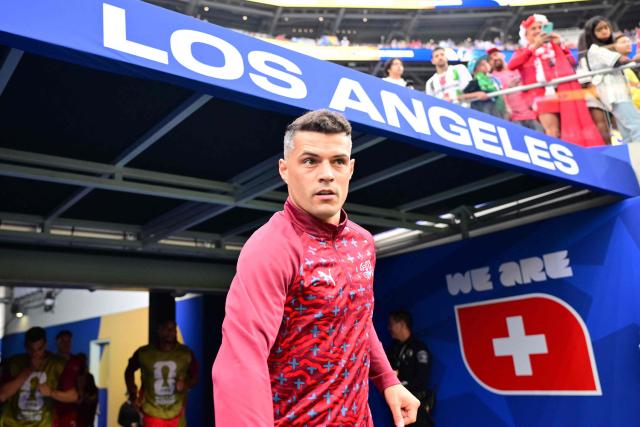 Switzerland's midfielder #10 Granit Xhaka walks onto the pitch to warm up ahead of the 2026 World Cup Group B football match between Switzerland and Bosnia and Herzegovina at Los Angeles Stadium in Inglewood on June 18, 2026.  (Photo by Frederic J. Brown / AFP)