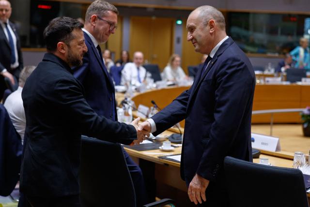 Ukraine's President Volodymyr Zelensky speaks with Bulgaria's Prime Minister Rumen Radev (R) as they attend a round table meeting of EU leaders and Ukraine during the EU Summit at the EU headquarters in Brussels, on June 18, 2026. (Photo by Geert Vanden Wijngaert / POOL / AFP)