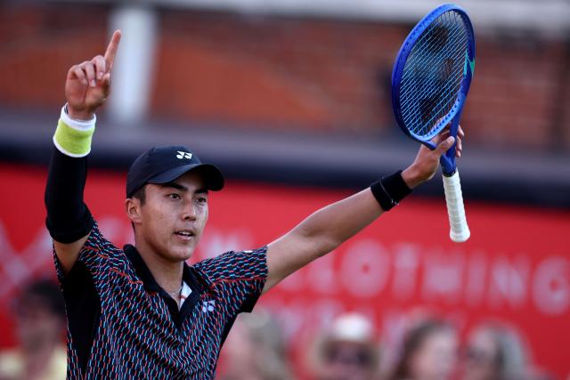 Australia's Rinky Hijikata celebrates winning against Czech Republic's Jiri Lehecka during their men's singles round of 16 tennis match on day three of the ATP HSBC Championships at Queen's Club in west London on June 18, 2026. (Photo by Henry Nicholls / AFP)