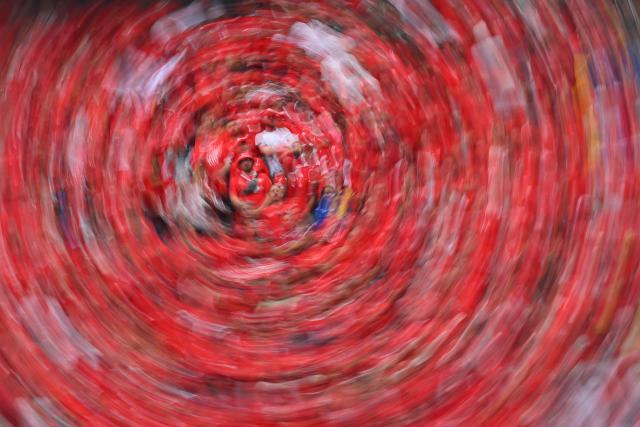 This slow shutter photograph show Swiss fans cheering for their team ahead of the 2026 World Cup Group B football match between Switzerland and Bosnia and Herzegovina at Los Angeles Stadium in Inglewood on June 18, 2026.  (Photo by Patrick T. Fallon / AFP)