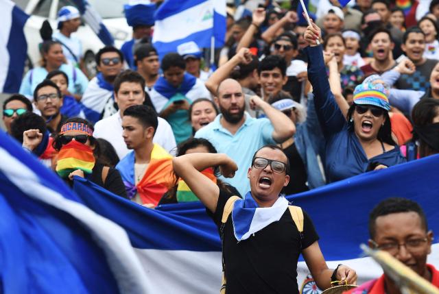 (FILES) Nicaraguan anti-government protesters, including members of the Lesbian, Gay, Bisexual, Transgender/Transsexual and Intersexed (LGBTI) movement, take part in an national LGBTI march for Justice and Democracy, in Managua on June 28, 2018. Women and LGBT people have been bearing the brunt of the Nicaraguan government’s “political repression” since the violent protests of 2018, according to a report by United Nations experts published on June 18, 2026. (Photo by Marvin RECINOS / AFP)