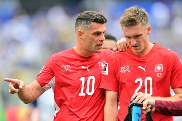 Switzerland's midfielder #10 Granit Xhaka speaks to midfielder #20 Michel Aebischer during the 2026 World Cup Group B football match between Switzerland and Bosnia and Herzegovina at Los Angeles Stadium in Inglewood on June 18, 2026.  (Photo by Frederic J. Brown / AFP)
