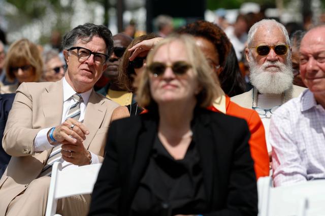 Former late-night show hosts Stephen Colbert (L) and David Letterman (R) attend opening day of the Barack Obama Presidential Center in Chicago, Illinois, on June 18, 2026. (Photo by Kamil Krzaczynski / AFP)