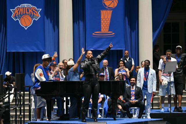 New York Mayor Zohran Mamdani (R) watches US singer-songwriter Alicia Keys perform during a championship celebration and Key to the City ceremony at City Hall Plaza after a ticker-tape parade honoring the Nicks' NBA Finals victory in New York City on June 18, 2026. (Photo by ANGELA WEISS / AFP)