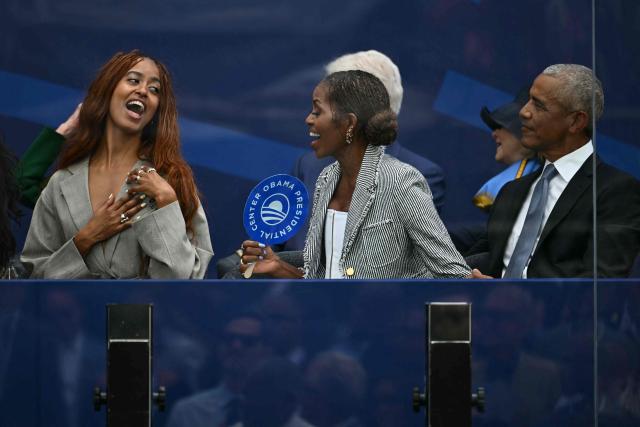 Former president Barack Obama, his wife Michelle Obama and their daughter Malia Obama attend the opening of the Barack Obama Presidential Center in Chicago, Illinois, on June 18, 2026. (Photo by Kent NISHIMURA / AFP)