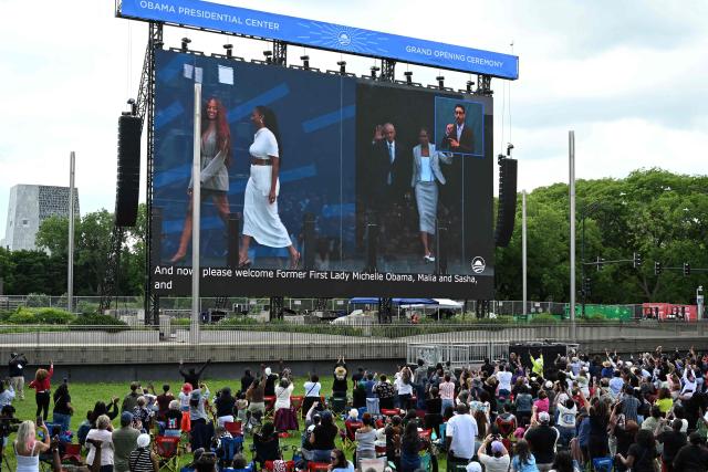 People attend a watch party for the opening of the Barack Obama Presidential Center along the Midway Plaisance in Chicago, Illinois, on June 18, 2026. (Photo by Alex WROBLEWSKI / AFP)