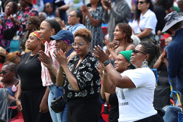 People attend a watch party for the opening of the Barack Obama Presidential Center along the Midway Plaisance in Chicago, Illinois, on June 18, 2026. (Photo by Alex WROBLEWSKI / AFP)