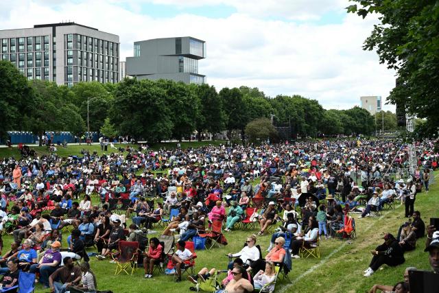 People attend a watch party for the opening of the Barack Obama Presidential Center along the Midway Plaisance in Chicago, Illinois, on June 18, 2026. (Photo by Alex WROBLEWSKI / AFP)