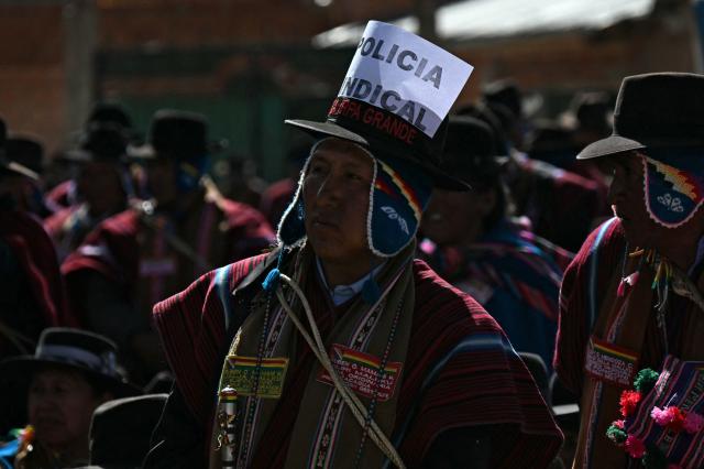 Members of the "Ponchos Rojos" community attend a meeting to discuss the future of protests ongoing for more than six weeks in Tilata, La Paz department, Bolivia, on June 18, 2026. For weeks, protesters demanding that US-backed conservative President Rodrigo Paz’s fledgling government address a deep economic crisis, while others called for his resignation, have marched and set up roadblocks, bringing Bolivia to a near standstill, driving up food and fuel prices and causing shortages of basic goods. (Photo by AIZAR RALDES / AFP)