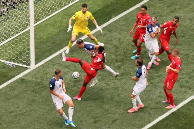 Switzerland's forward #07 Breel Embolo kicks the ball past Bosnia-Herzegovina's goalkeeper #01 Nikola Vasilj during the 2026 World Cup Group B football match between Switzerland and Bosnia and Herzegovina at Los Angeles Stadium in Inglewood on June 18, 2026.  (Photo by Etienne Laurent / AFP)