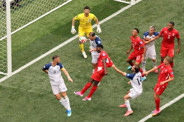 Switzerland's forward #07 Breel Embolo heads the ball past Bosnia-Herzegovina's defender #18 Nikola Katic during the 2026 World Cup Group B football match between Switzerland and Bosnia and Herzegovina at Los Angeles Stadium in Inglewood on June 18, 2026.  (Photo by Etienne Laurent / AFP)
