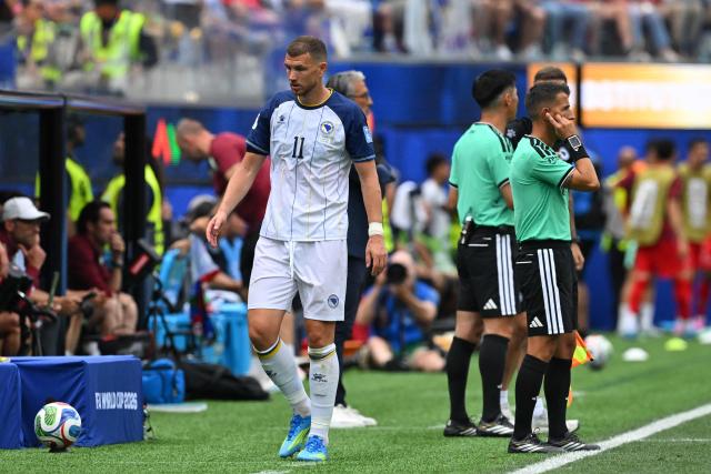 Bosnia-Herzegovina's forward #11 Edin Dzeko leaves the pitch after being substituted off during the 2026 World Cup Group B football match between Switzerland and Bosnia and Herzegovina at Los Angeles Stadium in Inglewood on June 18, 2026.  (Photo by Patrick T. Fallon / AFP)