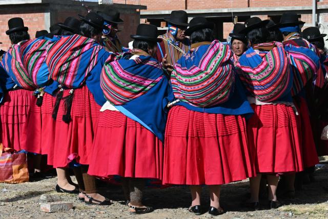 Women wearing traditional dress known as "cholitas" attend a meeting of "Ponchos Rojos" leaders to discuss the future of protests ongoing for more than six weeks in Tilata, La Paz department, Bolivia, on June 18, 2026. For weeks, protesters demanding that US-backed conservative President Rodrigo Pazs fledgling government address a deep economic crisis, while others called for his resignation, have marched and set up roadblocks, bringing Bolivia to a near standstill, driving up food and fuel prices and causing shortages of basic goods. (Photo by AIZAR RALDES / AFP)