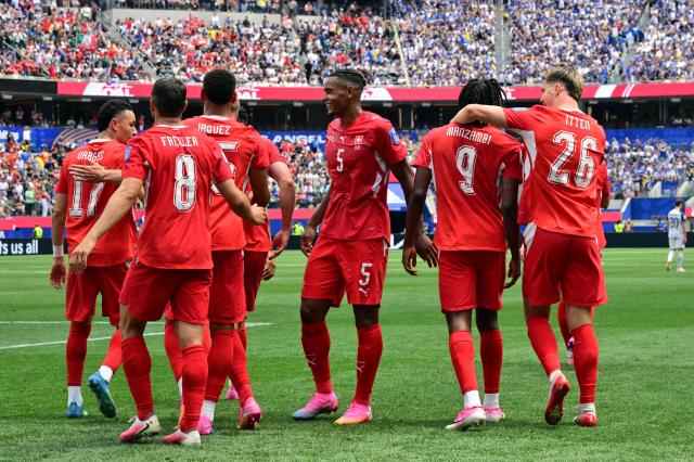 Switzerland's midfielder #09 Johan Manzambi celebrates scoring his team's third goal with teammates during the 2026 World Cup Group B football match between Switzerland and Bosnia and Herzegovina at Los Angeles Stadium in Inglewood on June 18, 2026.  (Photo by Frederic J. Brown / AFP)