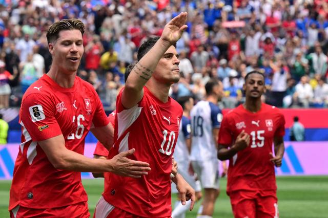 Switzerland's midfielder #10 Granit Xhaka celebrates scoring his team's fourth goal during the 2026 World Cup Group B football match between Switzerland and Bosnia and Herzegovina at Los Angeles Stadium in Inglewood on June 18, 2026.  (Photo by Frederic J. Brown / AFP)