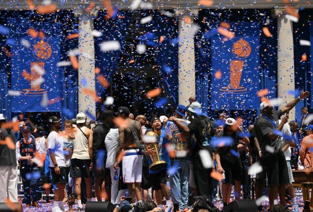 Members of the New York Knicks attend a championship celebration and Key to the City ceremony at City Hall Plaza after a ticker-tape parade honoring the team's NBA Finals victory in New York City on June 18, 2026. (Photo by ANGELA WEISS / AFP)
