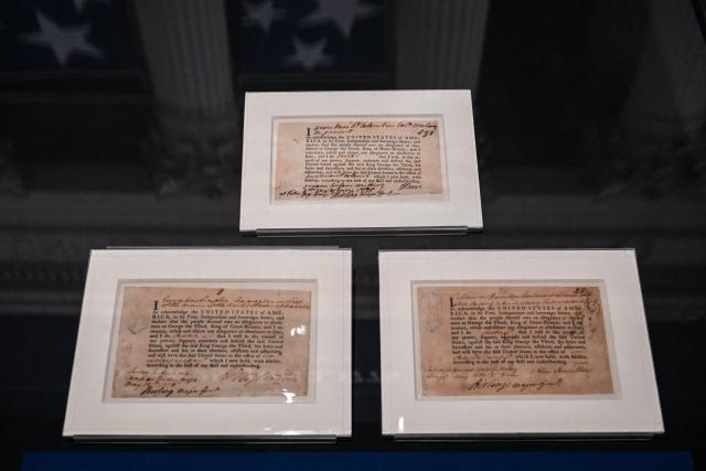The Oath of Allegiance text is displayed during a preview of the "Freedom Plane National Tour: Documents That Forged a Nation" exhibition at the Museum of Miami in Miami, Florida, on June 18, 2026. The museum is one of eight venues selected to host the National Archives traveling exhibition marking the 250th anniversary of the United States, from June 20 to July 5, 2026. (Photo by CHANDAN KHANNA / AFP)