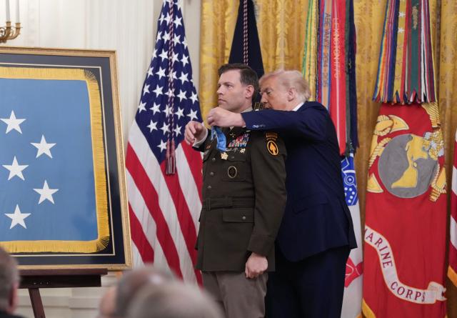 US President Donald Trump bestows the Medal of Honor to retired US Army Major Nicholas Dockery in the East Room of the White House in Washington, DC on June 18, 2026. (Photo by Ken Cedeno / AFP)