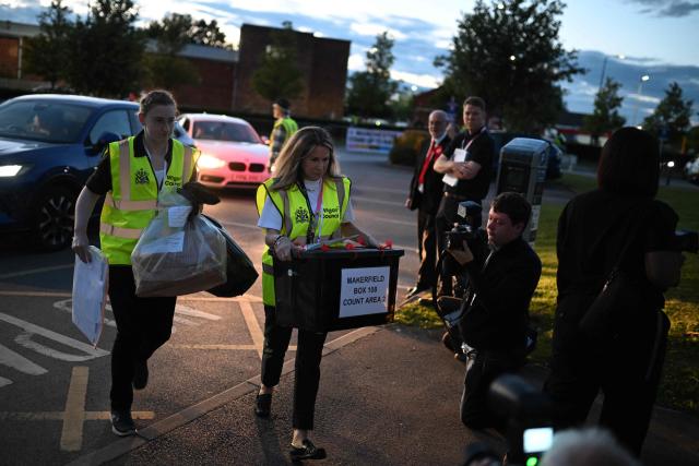 A ballot box is carried into the count centre to be opened and counted for the Makerfield by-election, at the Edge in Wigan, northwest England on June 18, 2026. (Photo by Oli SCARFF / AFP)