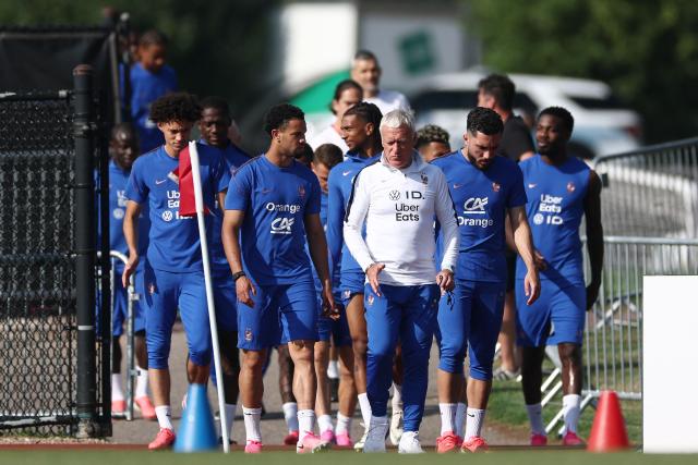 France's head coach Didier Deschamps and his players arrive for a training session at Bentley University in Waltham, near Boston, on June 18, 2026, for the 2026 World Cup football tournament. (Photo by FRANCK FIFE / AFP)