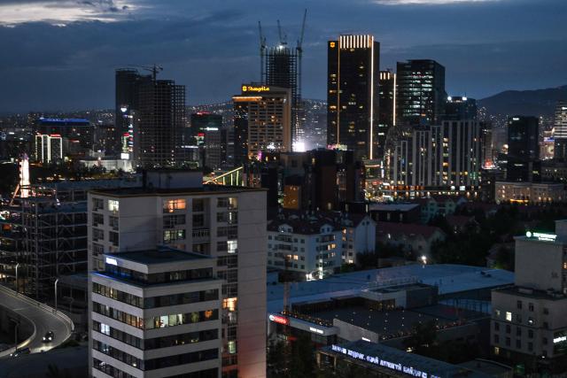 High-rise buildings are pictured in Ulaanbaatar on June 18, 2026. (Photo by ADEK BERRY / AFP)