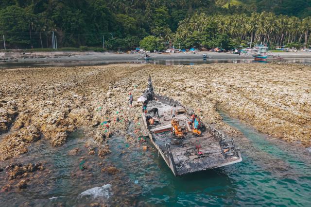 This photo taken on June 18, 2026, shows an aerial photo of the coastal uplift following an earthquake along the Pangyan Marine Sanctuary in Glan, Sarangani. A powerful earthquake that killed at least 61 people in the Philippines raised the seabed by as much as two metres (6.6 feet), exposing coral and harming marine life, the environment department said on June 14. (Photo by Ferdinandh Cabrera / AFP)