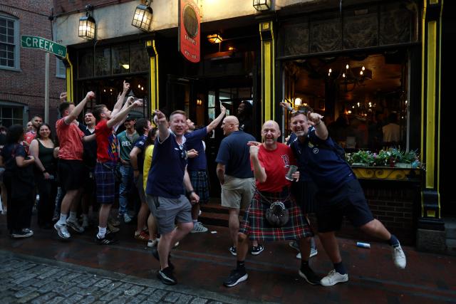 Scottish fans react as they gather on the eve of the 2026 World Cup Group C football match between Morocco and Scotland in Boston on June 18, 2026. (Photo by FRANCK FIFE / AFP)