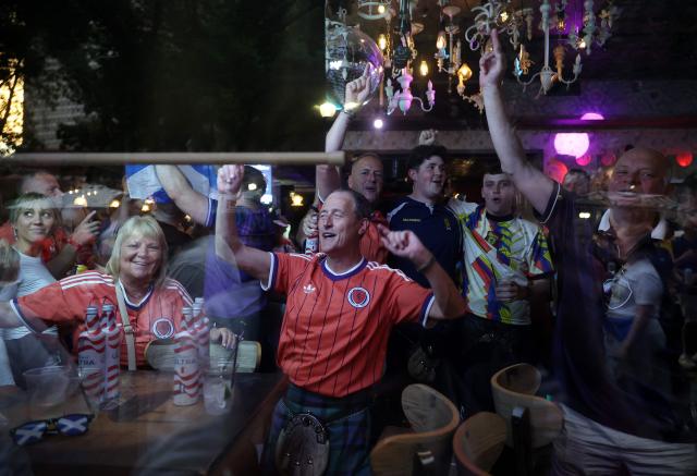 Scottish fans react as they gather on the eve of the 2026 World Cup Group C football match between Morocco and Scotland in Boston on June 18, 2026. (Photo by FRANCK FIFE / AFP)