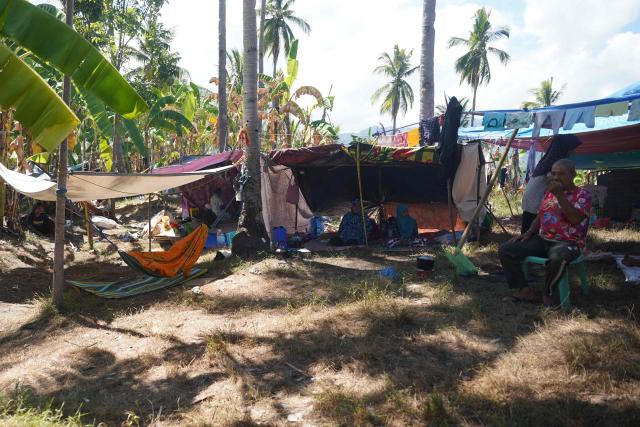 This photo taken on June 18, 2026, shows residents in makeshift tents after being evacuated due to an earthquake in Glan, Sarangani. A powerful earthquake that killed at least 61 people in the Philippines raised the seabed by as much as two metres (6.6 feet), exposing coral and harming marine life, the environment department said on June 14. (Photo by Ferdinandh Cabrera / AFP)