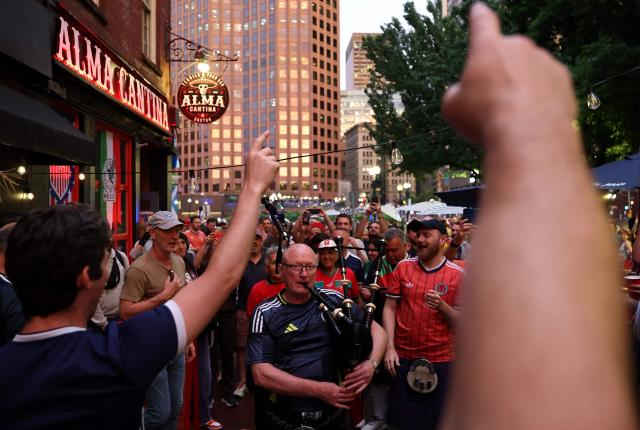 Scottish fans react as they gather on the eve of the 2026 World Cup Group C football match between Morocco and Scotland in Boston on June 18, 2026. (Photo by FRANCK FIFE / AFP)