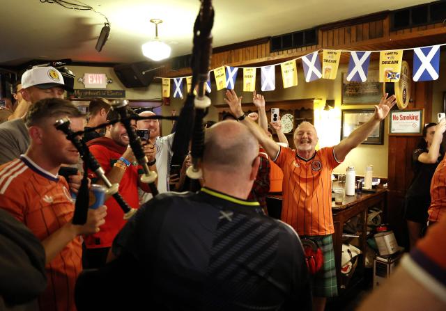 Scottish fans react as they gather on the eve of the 2026 World Cup Group C football match between Morocco and Scotland in Boston on June 18, 2026. (Photo by FRANCK FIFE / AFP)