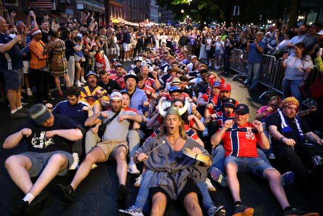 Scottish and Norwegian fans react as they gather on the eve of the 2026 World Cup Group C football match between Morocco and Scotland in Boston on June 18, 2026. (Photo by FRANCK FIFE / AFP)