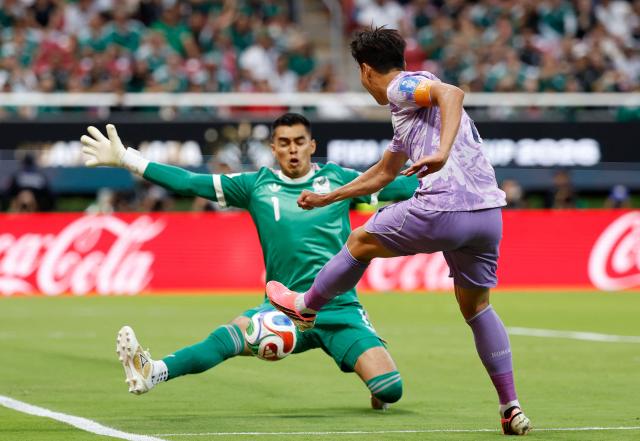 Mexico's goalkeeper #01 Raul Rangel and South Korea's forward #07 Son Heung-min fight for the ball during the 2026 World Cup Group A football match between Mexico and South Korea at the Guadalajara Stadium in Zapopan on June 18, 2026.  (Photo by Ulises RUIZ / AFP)