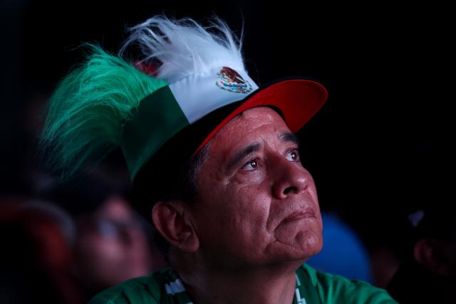 A Mexican fan watches the 2026 World Cup football match between Mexico and South Korea on a screen at the Fan Fest in Monterrey, Mexico, on June 18, 2026. (Photo by Julio Cesar AGUILAR / AFP)