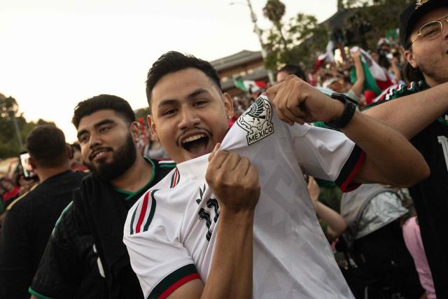 Mexico fans cheer after their team won the 2026 World Cup match between South Korea and Mexico at Seoul International Park in the Koreatown neighborhood of Los Angeles on June 18, 2026. (Photo by ETIENNE LAURENT / AFP)