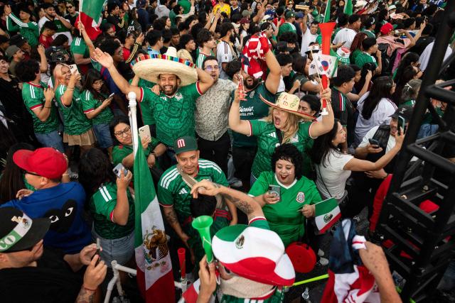 Mexico fans cheer after their team won the 2026 World Cup match between South Korea and Mexico at Seoul International Park in the Koreatown neighborhood of Los Angeles on June 18, 2026. (Photo by ETIENNE LAURENT / AFP)