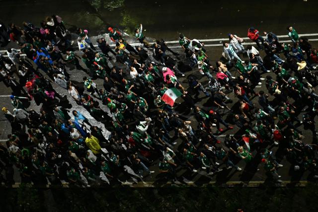 This aerial view shows Mexican fans celebrating on Reforma Avenue after their team won the 2026 World Cup football match against South Korea, in Mexico City on June 18, 2026. (Photo by YURI CORTEZ / AFP)