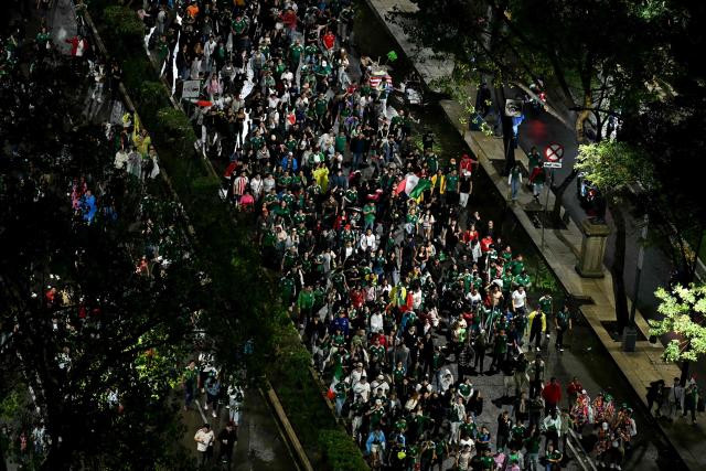 This aerial view shows Mexican fans celebrating on Reforma Avenue after their team won the 2026 World Cup football match against South Korea, in Mexico City on June 18, 2026. (Photo by YURI CORTEZ / AFP)