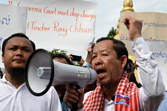 Rong Chhun (C), an advisor of the Nation Power Party, speaks to supporters outside the Supreme Court in Phnom Penh on June 19, 2026. Cambodia's top court on June 19 suspended a prison sentence handed to opposition politician Rong Chhun but upheld a ban on him running for office, his lawyer said, to the dismay of supporters. (Photo by TANG CHHIN Sothy / AFP)