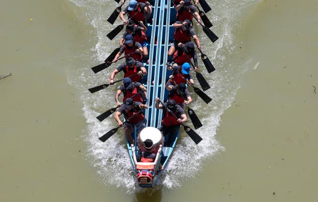 Rowers participate in a dragon boat race to celebrate the Dragon Boat Festival in Taipei on June 19, 2026 (Photo by I-Hwa Cheng / AFP)