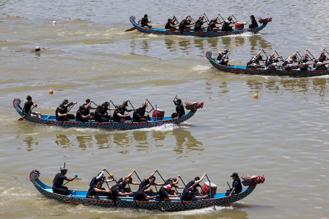 Rowers participate in a dragon boat race to celebrate the Dragon Boat Festival in Taipei on June 19, 2026 (Photo by I-Hwa Cheng / AFP)