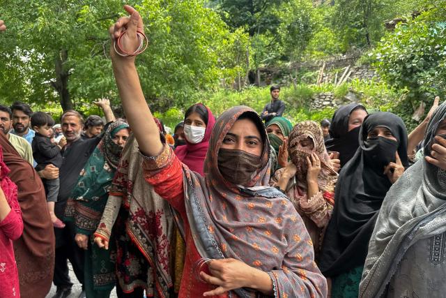 Supporters of the Joint Awami Action Committee (JAAC) gather during a weeks-long protest in Neelum Valley, in Pakistan-administered Kashmir, on June 18, 2026, following the group's ban under anti-terrorism laws by local authorities. A nearly two-week standoff between protesters and police in Pakistan-administered Kashmir has left residents grappling with food shortages, while the death toll from clashes rose to 22, according to an AFP tally on June 17. Supporters of the Joint Awami Action Committee (JAAC), an anti-government movement demanding economic and governance reforms, have pressed ahead with protests despite the group being banned this month under anti-terrorism laws. (Photo by AFP)