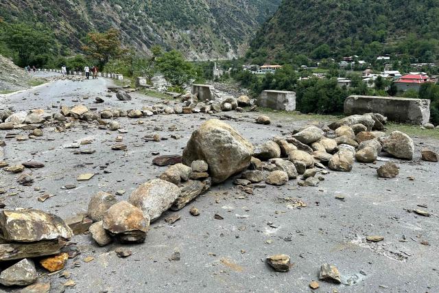 A general view shows a blocked road during a weeks-long protest by the supporters of the Joint Awami Action Committee (JAAC) in Neelum Valley, in Pakistan-administered Kashmir, on June 18, 2026, following the group's ban under anti-terrorism laws by local authorities. A nearly two-week standoff between protesters and police in Pakistan-administered Kashmir has left residents grappling with food shortages, while the death toll from clashes rose to 22, according to an AFP tally on June 17. Supporters of the Joint Awami Action Committee (JAAC), an anti-government movement demanding economic and governance reforms, have pressed ahead with protests despite the group being banned this month under anti-terrorism laws. (Photo by AFP)