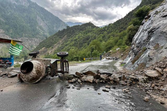 A general view shows a blocked road during a weeks-long protest by the supporters of the Joint Awami Action Committee (JAAC) in Neelum Valley, in Pakistan-administered Kashmir, on June 18, 2026, following the group's ban under anti-terrorism laws by local authorities. A nearly two-week standoff between protesters and police in Pakistan-administered Kashmir has left residents grappling with food shortages, while the death toll from clashes rose to 22, according to an AFP tally on June 17. Supporters of the Joint Awami Action Committee (JAAC), an anti-government movement demanding economic and governance reforms, have pressed ahead with protests despite the group being banned this month under anti-terrorism laws. (Photo by AFP)
