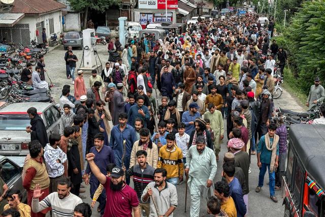 Supporters of the Joint Awami Action Committee (JAAC) gather during a weeks-long protest in Neelum Valley, in Pakistan-administered Kashmir, on June 18, 2026, following the group's ban under anti-terrorism laws by local authorities. A nearly two-week standoff between protesters and police in Pakistan-administered Kashmir has left residents grappling with food shortages, while the death toll from clashes rose to 22, according to an AFP tally on June 17. Supporters of the Joint Awami Action Committee (JAAC), an anti-government movement demanding economic and governance reforms, have pressed ahead with protests despite the group being banned this month under anti-terrorism laws. (Photo by AFP)