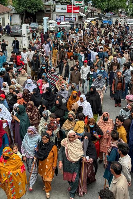 Supporters of the Joint Awami Action Committee (JAAC) gather during a weeks-long protest in Neelum Valley, in Pakistan-administered Kashmir, on June 18, 2026, following the group's ban under anti-terrorism laws by local authorities. A nearly two-week standoff between protesters and police in Pakistan-administered Kashmir has left residents grappling with food shortages, while the death toll from clashes rose to 22, according to an AFP tally on June 17. Supporters of the Joint Awami Action Committee (JAAC), an anti-government movement demanding economic and governance reforms, have pressed ahead with protests despite the group being banned this month under anti-terrorism laws. (Photo by AFP)
