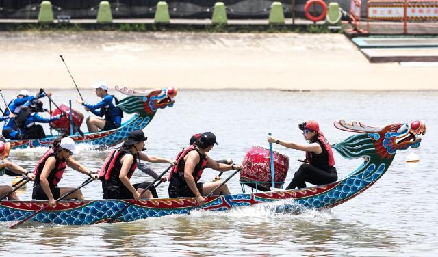 Rowers participate in a dragon boat race to celebrate the Dragon Boat Festival in Taipei on June 19, 2026 (Photo by I-Hwa Cheng / AFP)