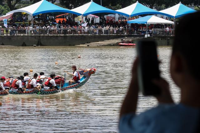 Rowers participate in a dragon boat race to celebrate the Dragon Boat Festival in Taipei on June 19, 2026 (Photo by I-Hwa Cheng / AFP)