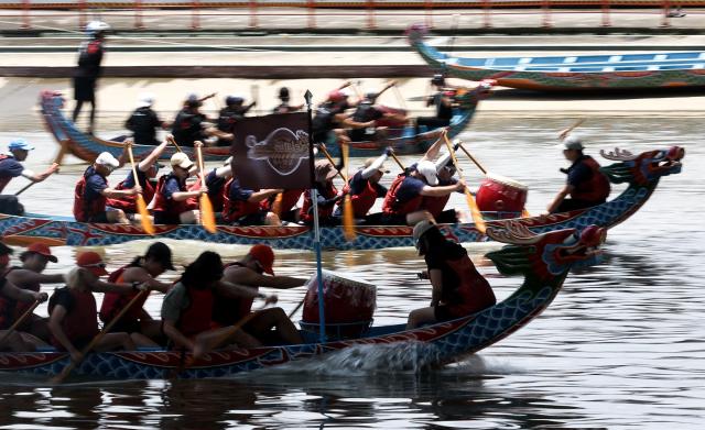 Rowers participate in a dragon boat race to celebrate the Dragon Boat Festival in Taipei on June 19, 2026 (Photo by I-Hwa Cheng / AFP)